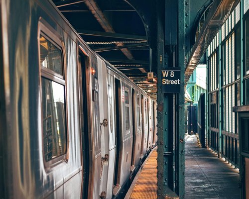 Individuals walking comfortably in a clean urban public transport station